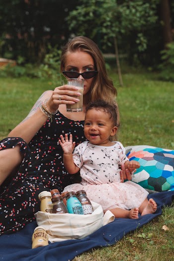 Woman And Toddler On Grass