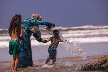 Woman and Two Boys on Shore