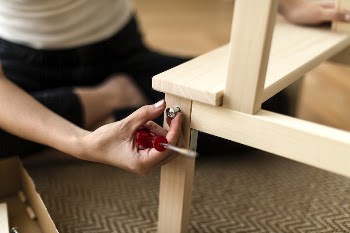 Woman assembling a diy chair | Free Photo - rawpixel