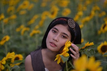 Woman At A Sunflower Field