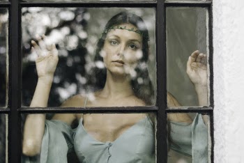 Woman At A Window