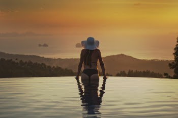 Woman At The Edge Of The Pool