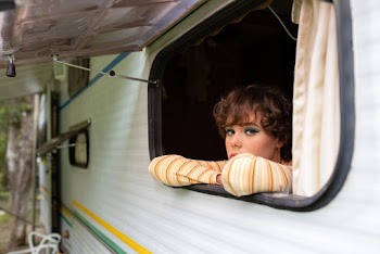 Woman at the Window of a Camper