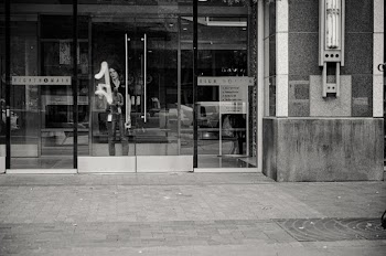 Woman Behind Glass Door