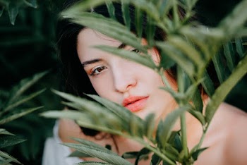 Woman Behind Green Leafed Plant