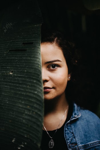 Woman Behind Leaf