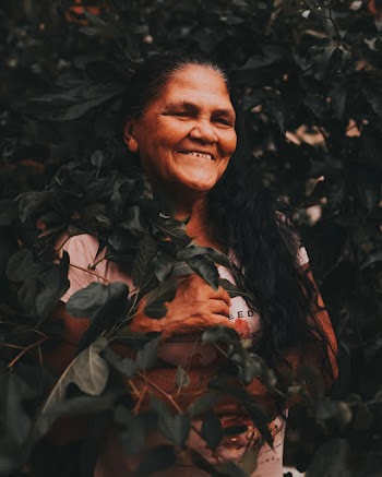 Woman Behind Plant