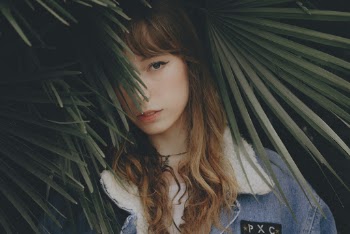 Woman Behind Plant