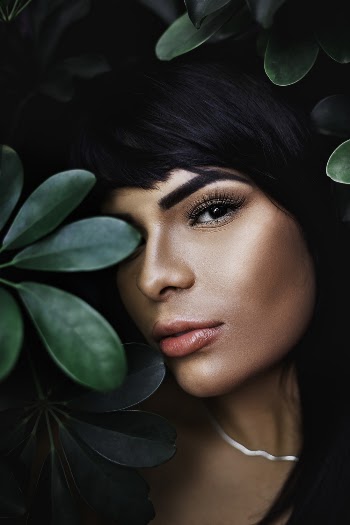 Woman Behind Plant