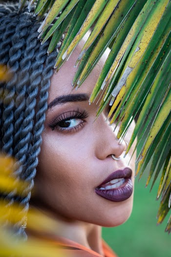 Woman Behind Plant