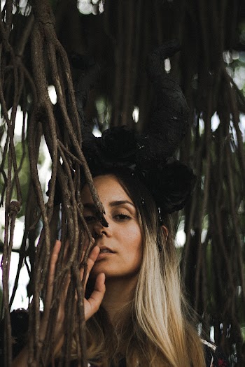 Woman Behind Plant