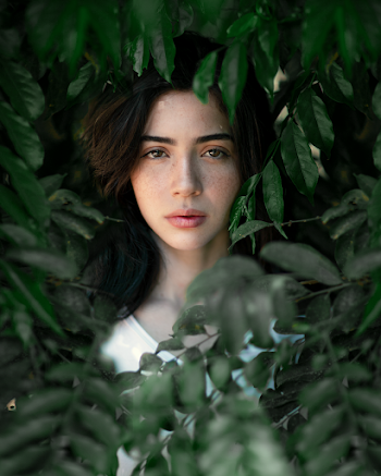 Woman Behind Plants