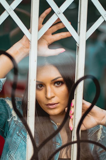 Woman Behind Railings