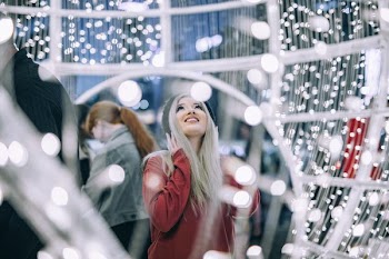 woman behind white light fixture