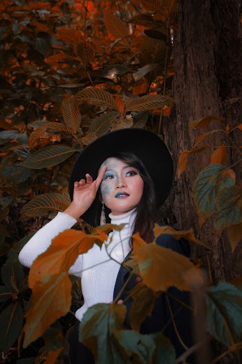 Woman Beside A Tree