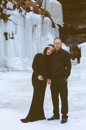 woman beside a woman standing on snow