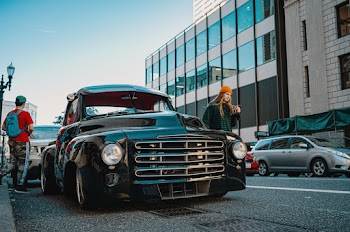 Woman Beside Black Vehicle