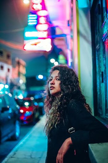 woman beside building structure