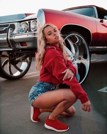 woman beside car