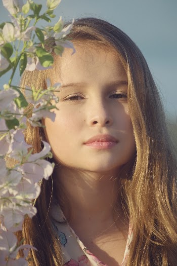 Woman Beside White-Petaled Flowers