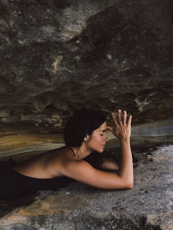 Woman Between Rock Formation