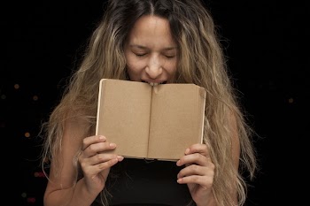 Woman Biting Book