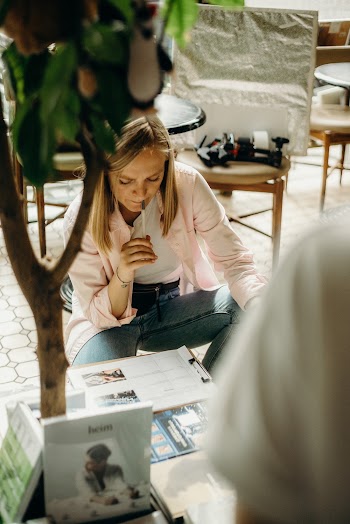 Woman Biting Her Pen while Thinking