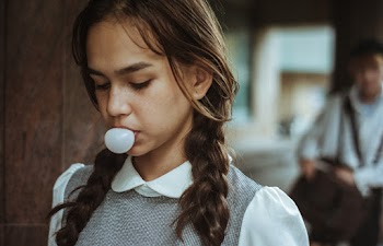 Woman Blowing Bubble Gum