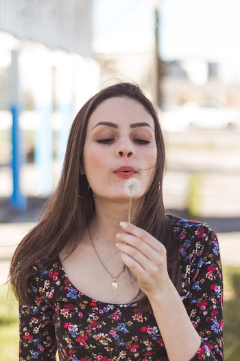 Woman Blowing Dandelion Flower