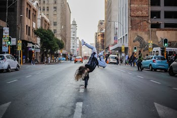 Woman Breakdancing on Street