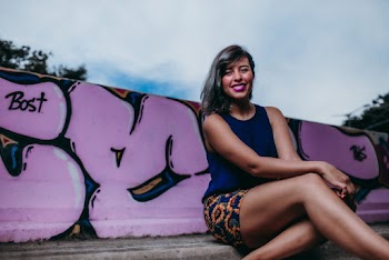 Woman by a Pink Graffiti Wall