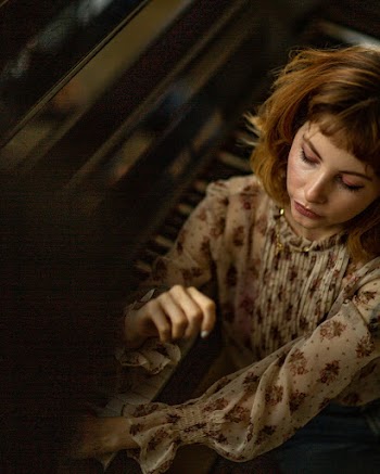 Woman By The Piano