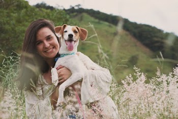 Woman Carries Dog Outdoor