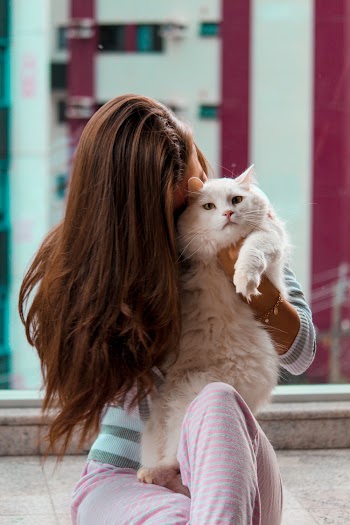Woman Carryiing Cat