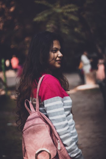 Woman Carrying A Backpack