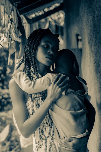 Woman Carrying Baby