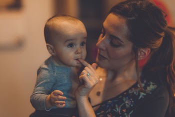 Woman Carrying Baby