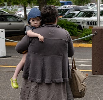 Woman Carrying Baby