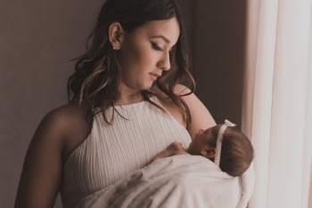 Woman Carrying Baby