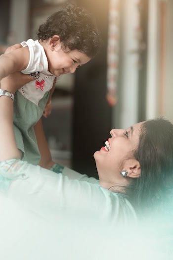 Woman Carrying Baby