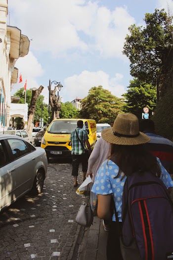 Woman Carrying Black and Red Backpack