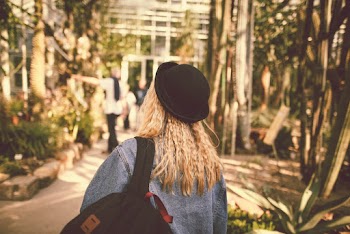 Woman Carrying Black Backpack