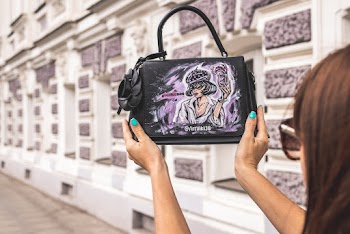 Woman Carrying Black Leather 2-way Bag
