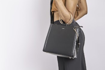 Woman Carrying Black Leather Bag