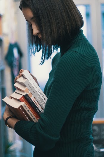 Woman Carrying Books