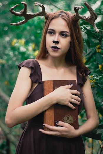 Woman Carrying Brown Book