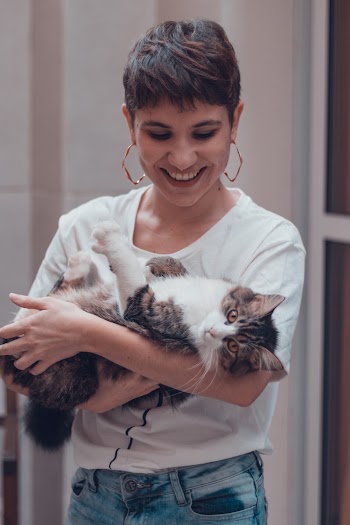 Woman Carrying Cat