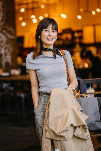 Woman Carrying Coat And Bag
