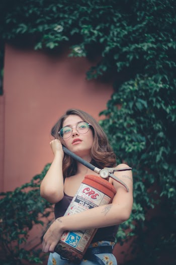 Woman Carrying Fire Extinguisher 
