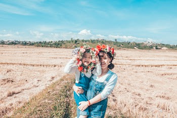 Woman Carrying Girl